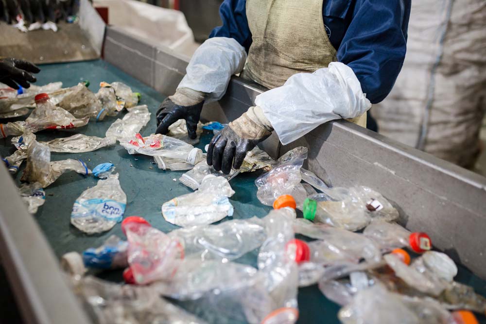 Workers sorting plastic